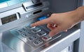 A hand with a lightcolored nail is pressing the number 3 on an ATM keypad. The metallic keypad has numbers 2, 3, 4, 5, 7, 8, 0,