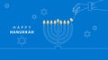 Hand Lighting Candle On Metal Hanukkah Menorah On Surface Against Blue Background. Man lighting up candles in menorah. Jewish Man