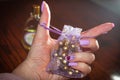 In the hand the lilac bag in the color of shellac nails