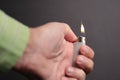 A hand with a lit lighter... Royalty Free Stock Photo