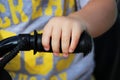 hand a little kid who rides bicycle. Royalty Free Stock Photo