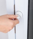 Hand locking door knob of glass door Royalty Free Stock Photo