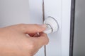 Hand locking door knob of glass door Royalty Free Stock Photo