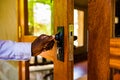 Hand Locking Metalic Lock On A Wooden Door In Kenya East Africa