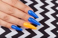 Hand with long artificial manicured nails Royalty Free Stock Photo