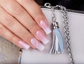 Hand with long artificial manicured nails with ombre gradient design Royalty Free Stock Photo