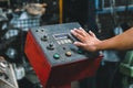Hand of machine engineer are pressing button power execute machine. Royalty Free Stock Photo