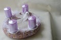 Hand made advent wreath with pink candles, white feathers and dove