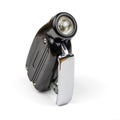 Handmade black vintage flashlight with dynamo generator. Isolated on white with light shadow. Royalty Free Stock Photo