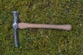 Hand made blacksmith hammer on the grass