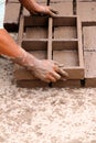 Worker making bricks