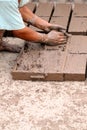 Hands of worker making bricks