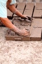 Hands of worker making bricks