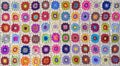 Patterned flower crochet blanket, background. Royalty Free Stock Photo