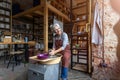 Elderly woman making ceramic work with potter`s wheel Royalty Free Stock Photo