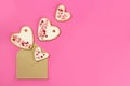 Hand made cookie hearts flying out of an envelope