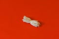 Hand made cotton wicks and raw cotton on isolated red background