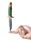 Hand Made Damascus hunting knife on one finger Royalty Free Stock Photo