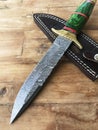 Hand Made Damascus hunting knife and sheath Royalty Free Stock Photo