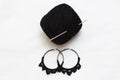 Hand made earing with black wool Royalty Free Stock Photo