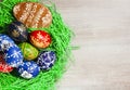 Hand made easter egg with gingerbread in green grass on rustick Royalty Free Stock Photo