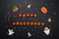 The hand-made eatable gingerbread Halloween inscription, pumpkin, ghosts, bat and sceletons