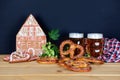 The hand-made eatable gingerbread house, beer, hops, pretzels for Octoberfest