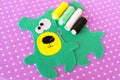 Hand made felt green bear set on violet background with polka dots. How to sew a Teddy bear toy. Step