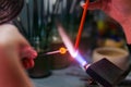Hand-made flameworking in a glass-blowing workshop Royalty Free Stock Photo
