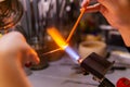 Hand-made glass beadmaking in a glass-blowing workshop Royalty Free Stock Photo