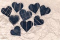 Hand made Jeans hearts on a crumpled craft paper background. Flat lay, top view, minimal style, copy space for text Royalty Free Stock Photo