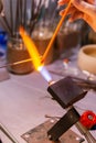 Hand-made lampworking in a glass-blowing workshop Royalty Free Stock Photo