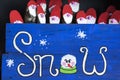 Hand made log Santa`s and snow sign in Scotland.