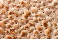 Hand-made matzah on Pesach holiday. Top view of flatbread matzo, macro, background Royalty Free Stock Photo