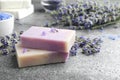 Hand made soap bars with lavender flowers on grey stone table Royalty Free Stock Photo