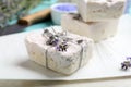 Hand made soap bars with lavender flowers on white, closeup Royalty Free Stock Photo