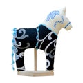 Hand made soft toy horse isolated on black with blue on the stan