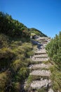 Hand made steps on a mountain hiking path for safety Royalty Free Stock Photo