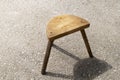 Hand made wooden stool standing outside