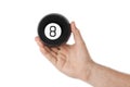 Hand with magic billiard ball number eight Royalty Free Stock Photo