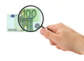 Hand magnifying 100 Euro note