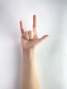 Hand make rock and roll sign simbol  on white background male female black silver ok gestures finger Caucasian arm close Royalty Free Stock Photo