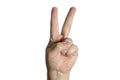 Hand making victory sign with two fingers. White background Royalty Free Stock Photo