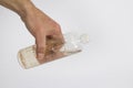 Hand of male holding traditional Turkish cologne on white with copy space.