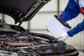 Hand of male mechanic changing car battery, Car battery repairman