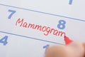 Hand with mammogram written on calendar Royalty Free Stock Photo