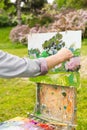 Hand of a man artist in the open air Royalty Free Stock Photo