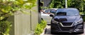 Hand Man in car receiving coffee in drive thru fast food restaurant.