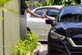 Hand Man in car receiving coffee in drive thru fast food restaurant.