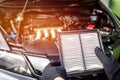 Hand a man change and check air filter of car in the engine room Royalty Free Stock Photo